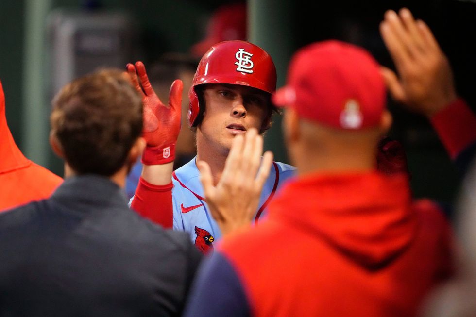 St. Louis Cardinals designated hitter Nolan Gorman (16) celebrates with teammates after hitting a home run against the Boston Red Sox during the fourth inning at Fenway Park.