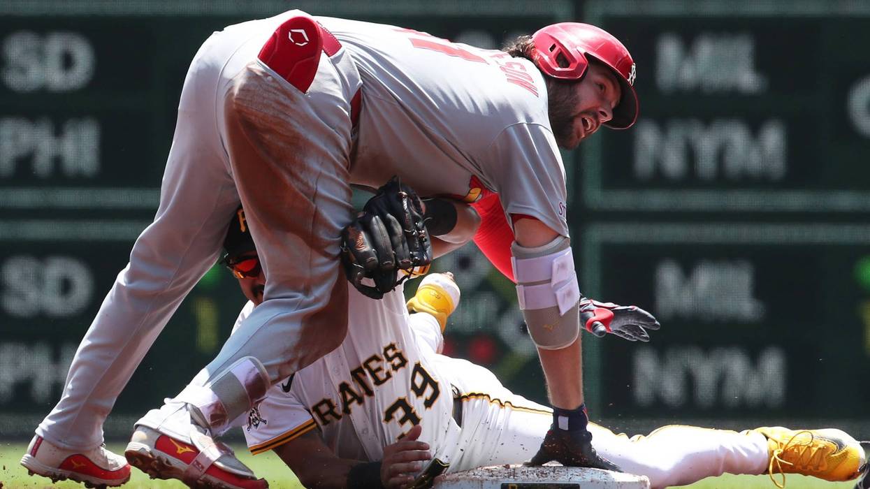 St. Louis Cardinals first baseman Alec Burleson (41) arrives at second base with a double as Pittsburgh Pirates second baseman Nick Gonzales (39) applies a late tag during the third inning at PNC Park.