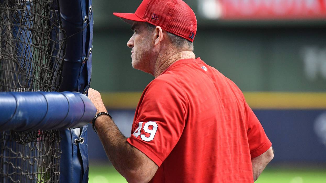 St. Louis Cardinals hitting coach Turner Ward (49) watches St. Louis Cardinals center fielder Tyler O'Neill (27) take batting practice before their game against Milwaukee Brewers at American Family Field.