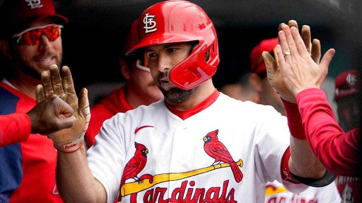 St. Louis Cardinals' Paul Goldschmidt is congratulated by teammates after hitting a solo home run during the first inning