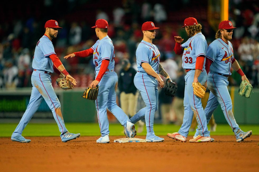 St. Louis Cardinals right fielder Dylan Carlson (3) and shortstop Tommy Edman (19) and left fielder Tyler O