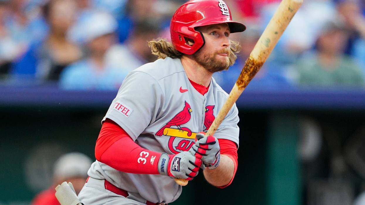 St. Louis Cardinals second baseman Brendan Donovan (33) hits a double during the fourth inning against the Kansas City Royals at Kauffman Stadium.