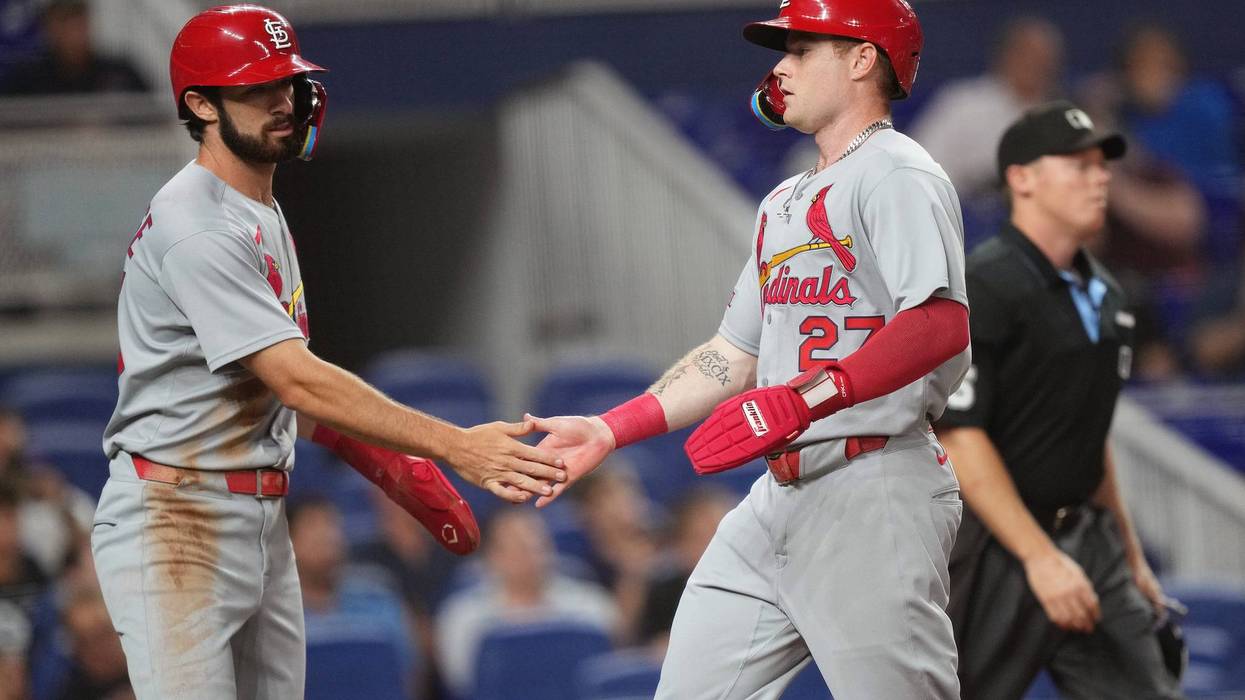 St. Louis Cardinals second baseman Thomas Saggese (25) congratulates center fielder Nathan Church (27) on scoring a run in the second inning against the Miami Marlins at loanDepot Park.