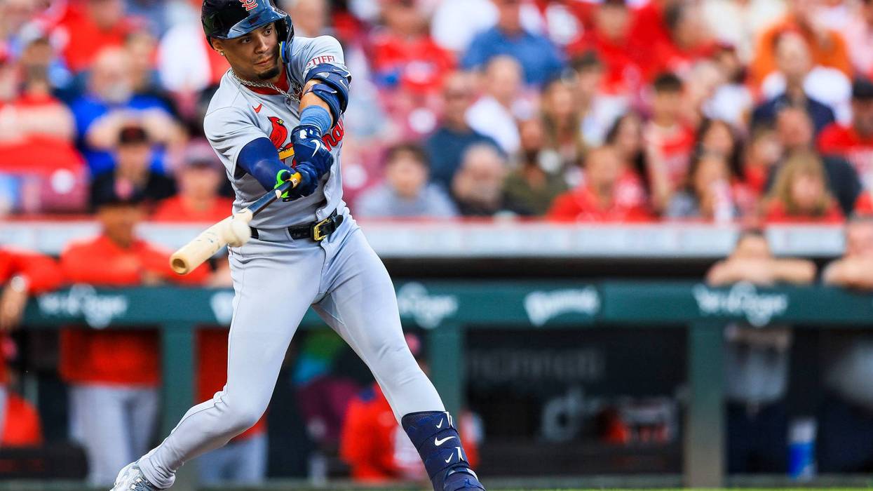 St. Louis Cardinals shortstop Masyn Winn (0) hits a RBI single in the third inning against the Cincinnati Reds at Great American Ball Park.