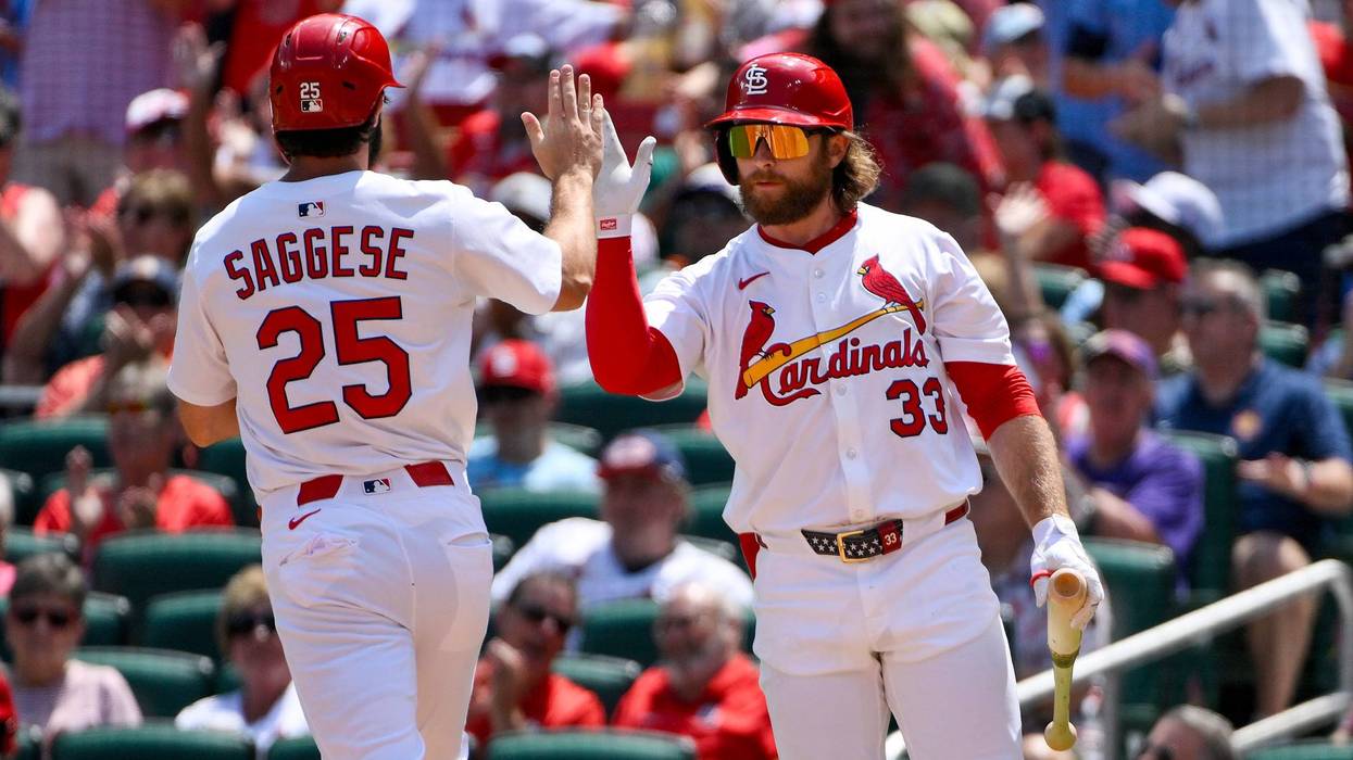 St. Louis Cardinals third baseman Thomas Saggese (25) is congratulated by second baseman Brendan Donovan (33) after scoring against the Colorado Rockies during the second inning at Busch Stadium.