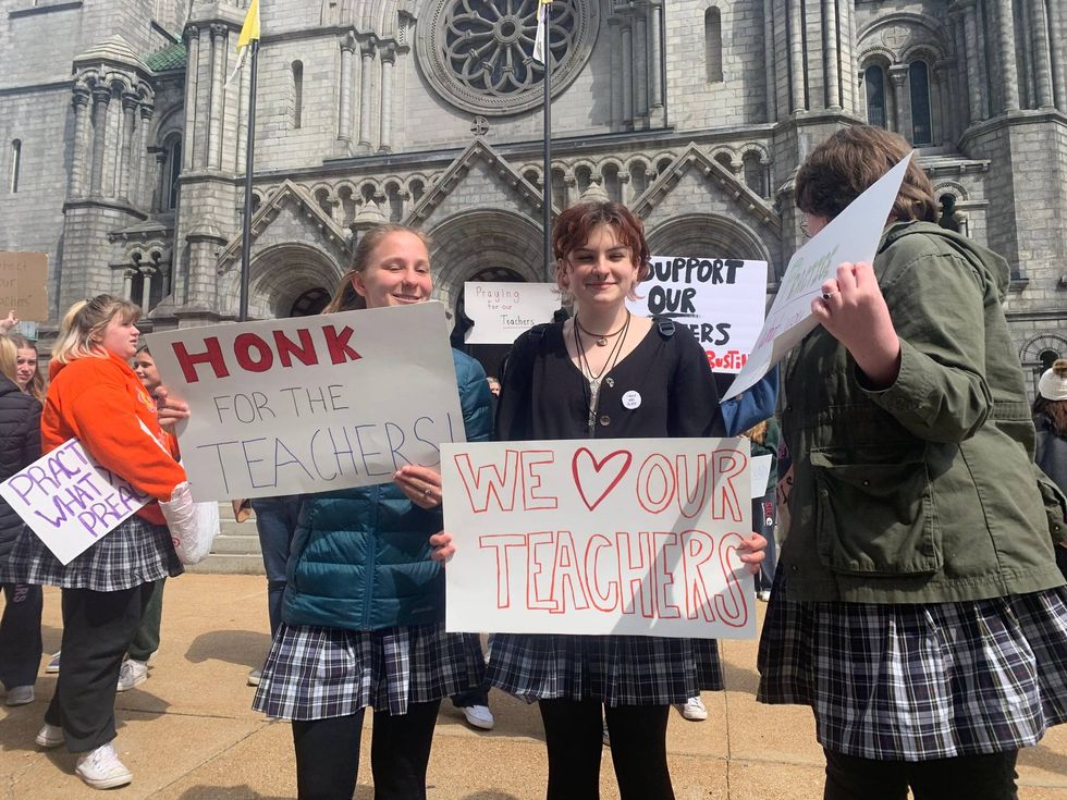 St. Louis Catholic High School students rally to show support for teachers in an ongoing labor dispute with the Archdiocese