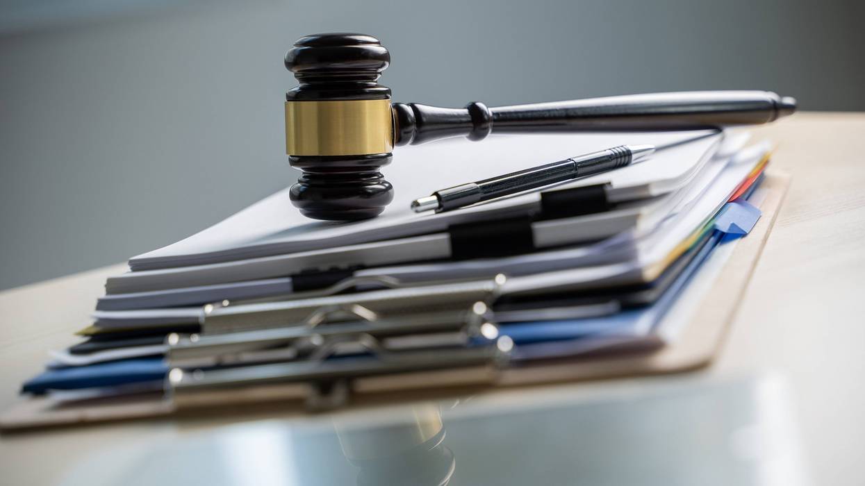 stack of papers with gavel on top