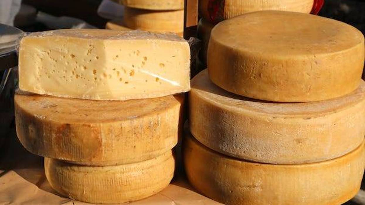 Stacked wheels of cheese