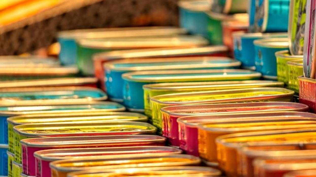 Stacks of colorful cans in an art display