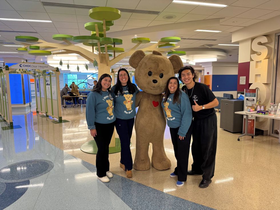 Staff members Becca, Paulina, Jennifer Hayakawa, and Edison during a recent pop-up gallery for Dear Hospital.