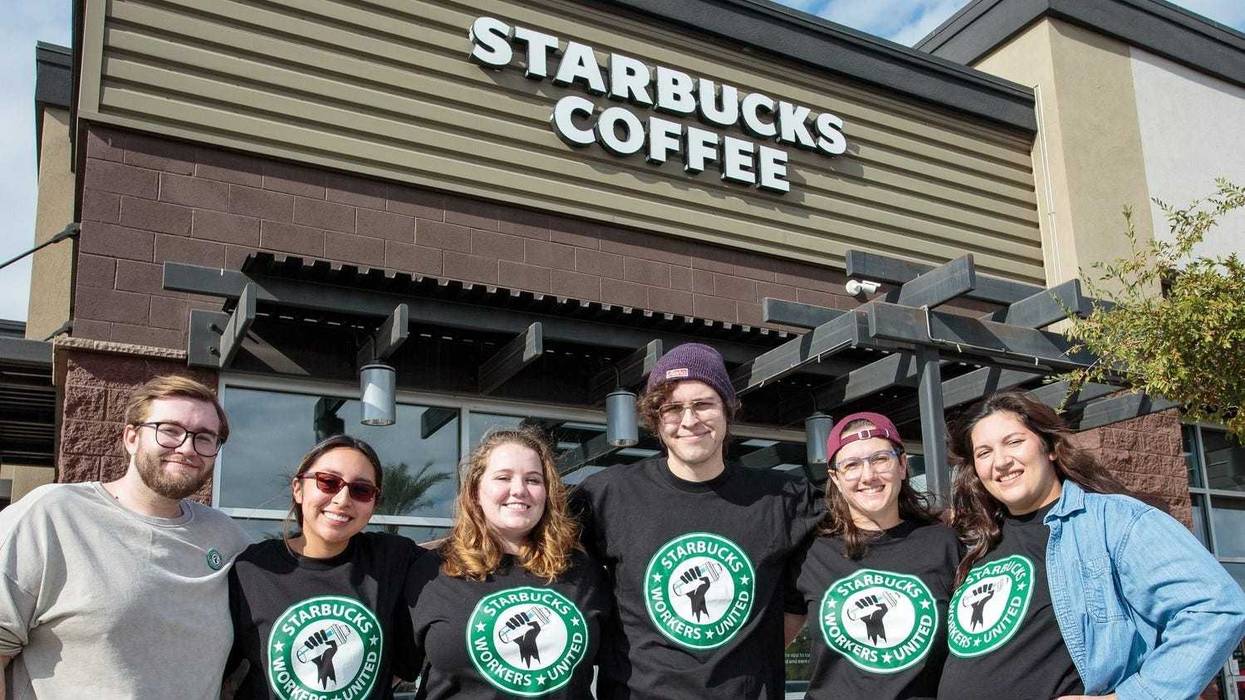 Starbucks employees who have filed for a union election to be the first Starbucks in Arizona to form a union stand outside their store on the southeast corner of Power and Baseline roads in Mesa.