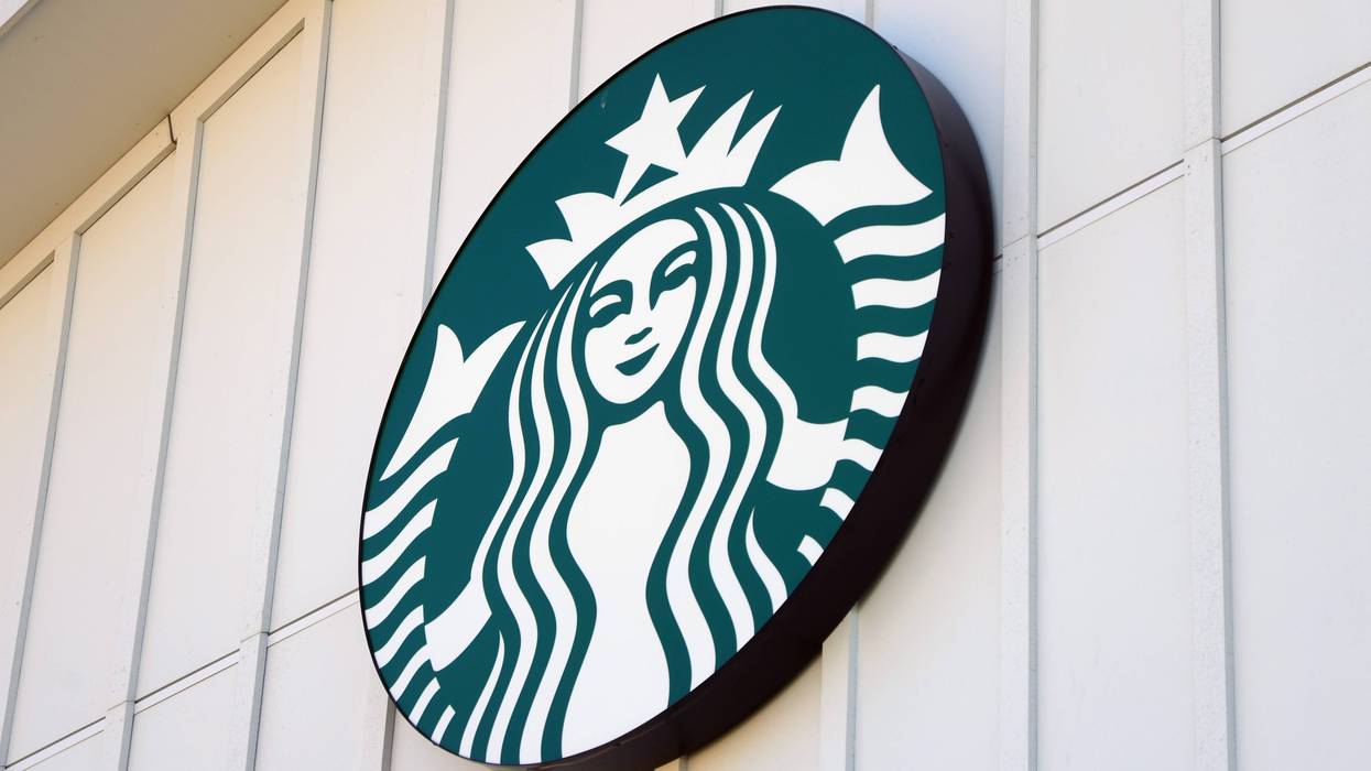 Starbucks logo sign on a wall