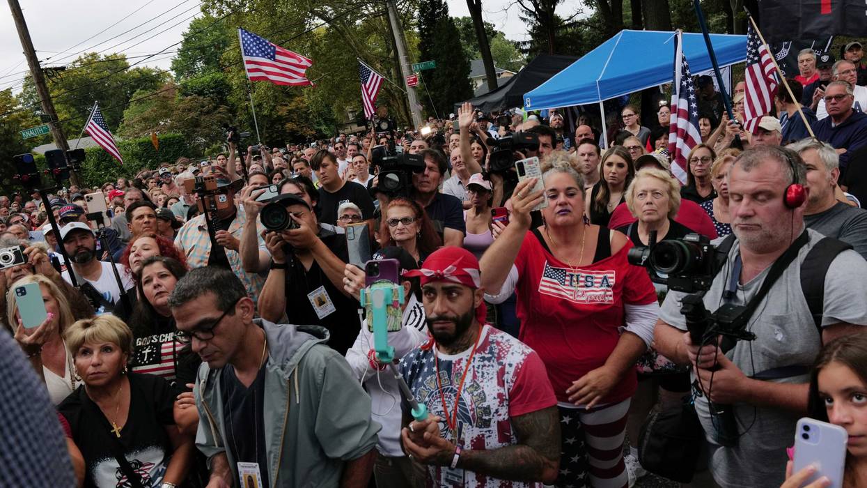 Staten Island residents gather to protest outside of a closed Catholic school-turned-migrant shelter on Staten Island on Aug. 28, 2023