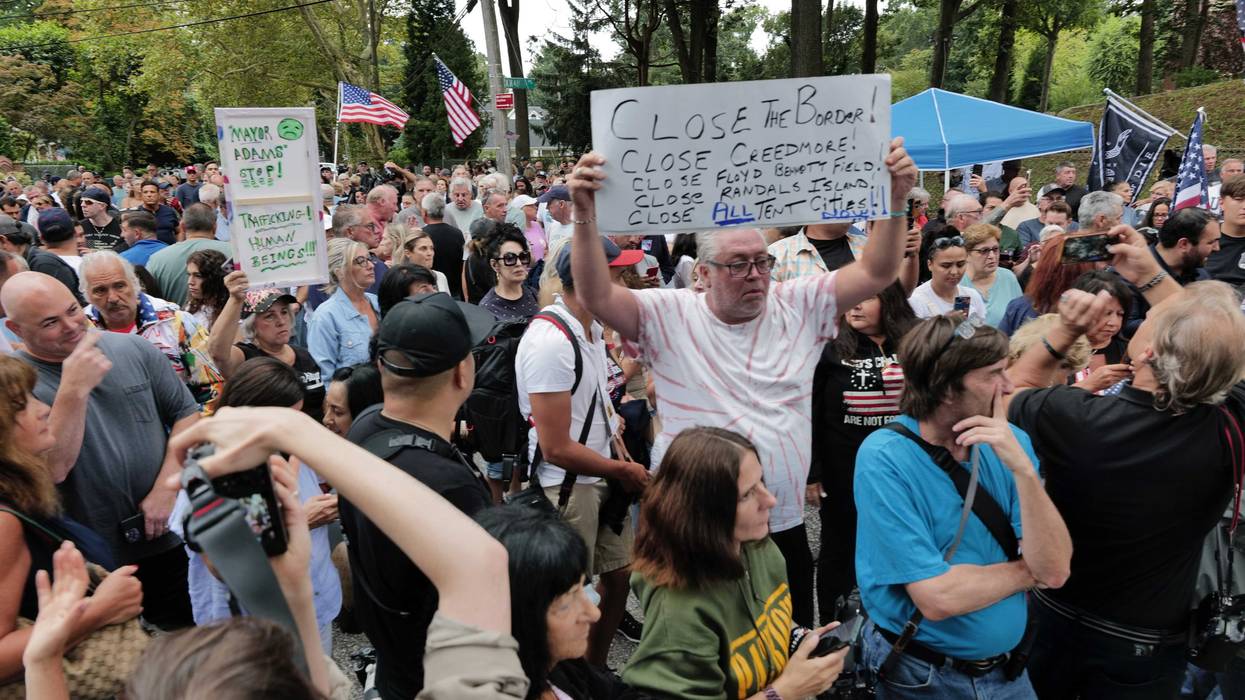 Staten Island residents gather to protest outside of a closed Catholic school-turned-migrant shelter on Staten Island on August 28, 2023 in New York City.