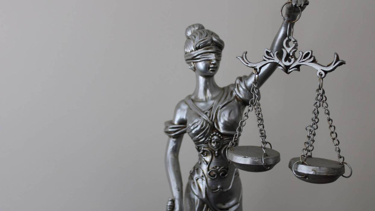 Statue of a woman symbolizing justice and law. justice and scales.
