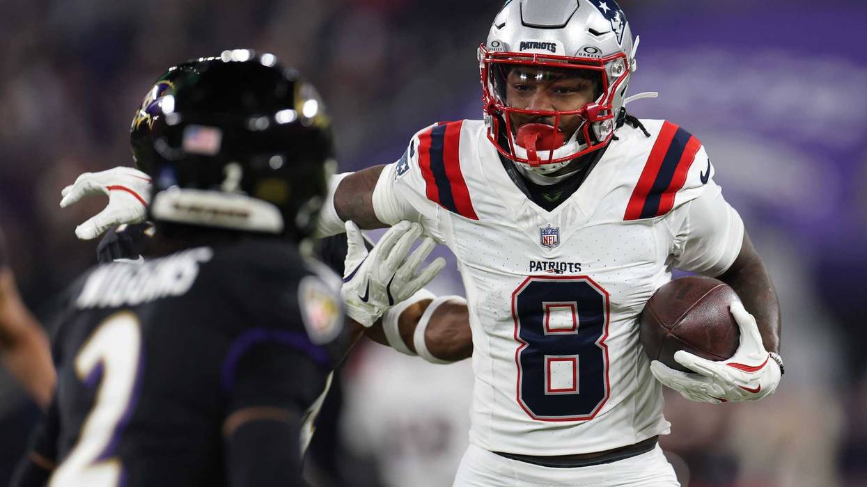 Stefon Diggs #8 of the New England Patriots carries the ball after a reception against the Baltimore Ravens during the second quarter at M&T Bank Stadium on December 21, 2025 in Baltimore, Maryland.