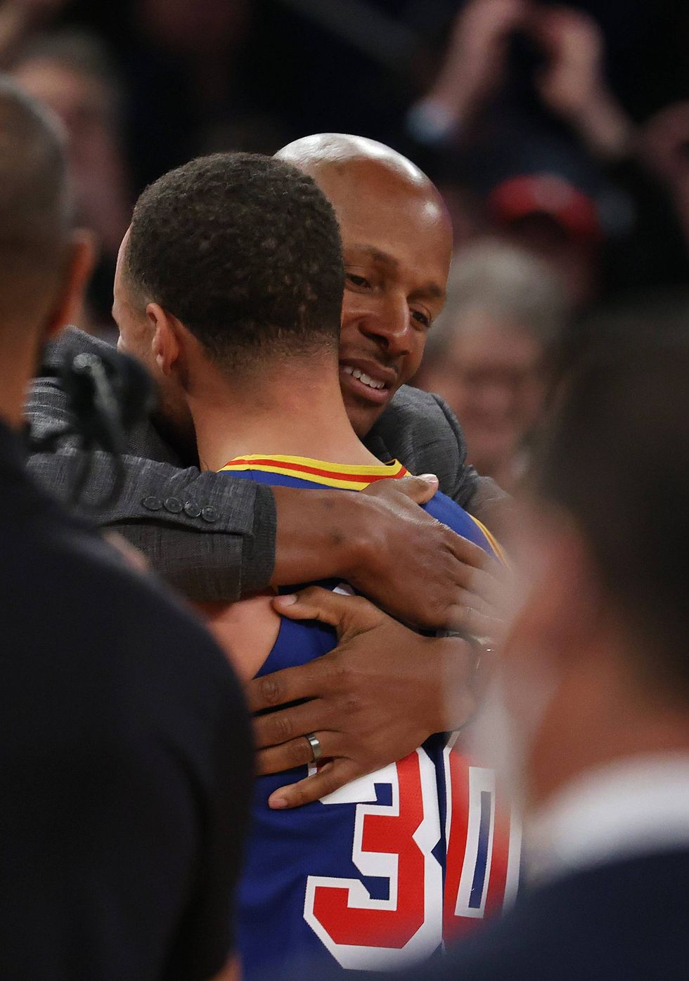 Stephen Curry #30 of the Golden State Warriors hugs Ray Allen after making a three point basket to break Allen