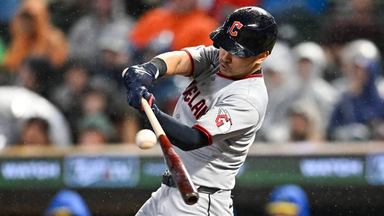 Steven Kwan #38 of the Cleveland Guardians hits an RBI double against the Minnesota Twins in the ninth inning of the game at Target Field on September 19, 2025 in Minneapolis, Minnesota.