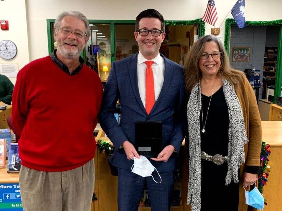 Steven Sokohl (center) with his parents