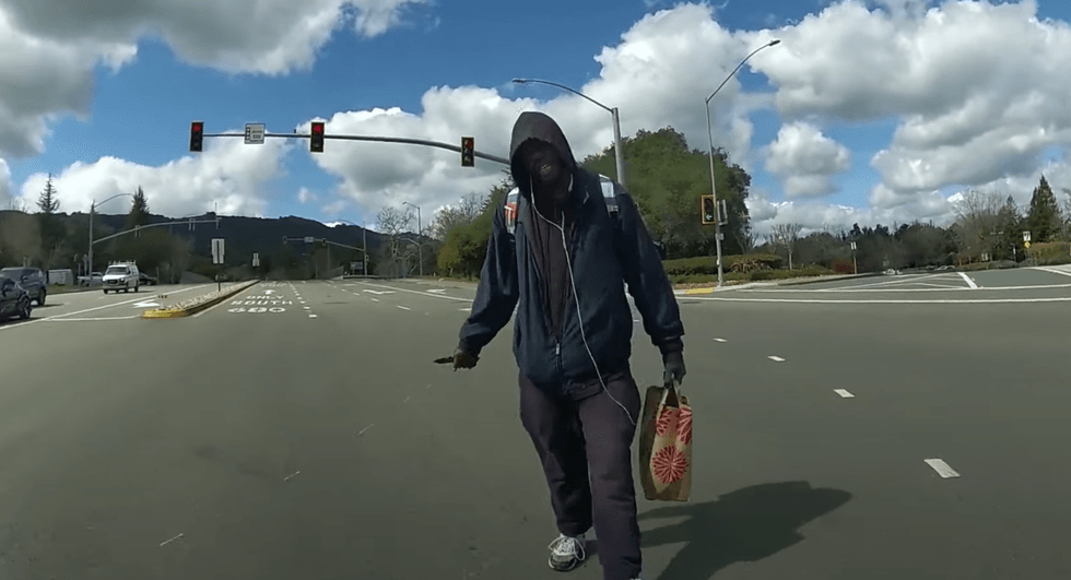 Still shot taken from body cam footage as Officer Andrew Hall approached Tyrell Wilson in the middle of an intersection on March 11.