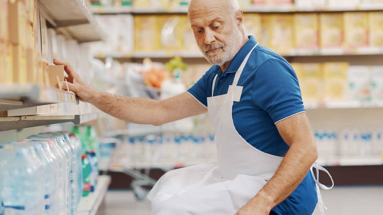 Stock clerk working at the supermarket.