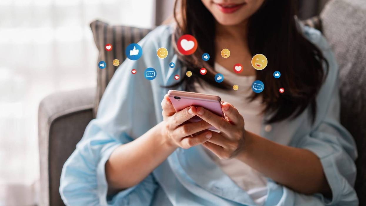 Stock image illustration of teen using social media on phone