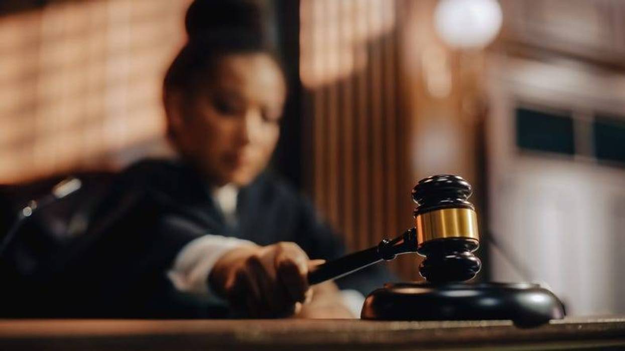 stock image of a female judge with a gavel