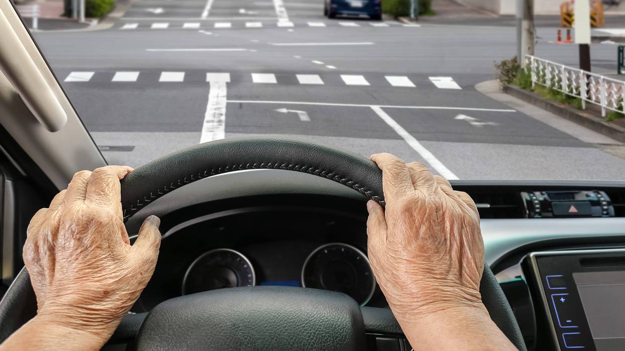 Stock image of senior driving