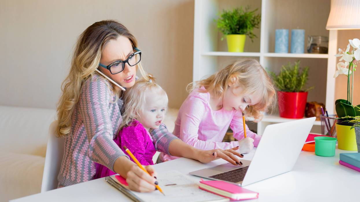 Stock photo of busy mother with kids