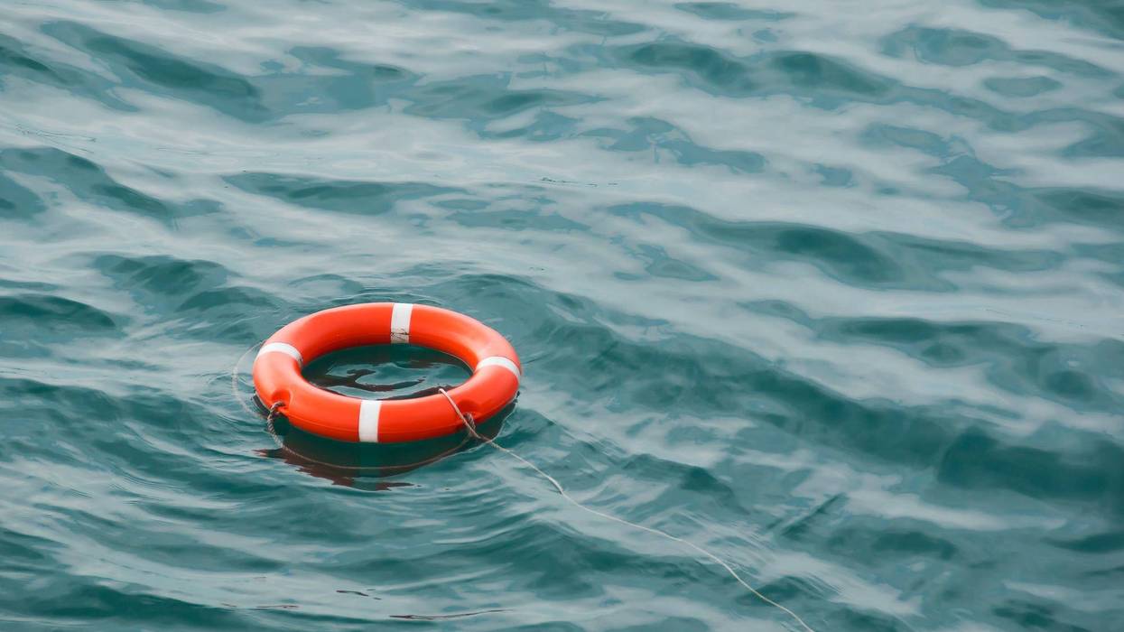 Stock photo of life ring in water