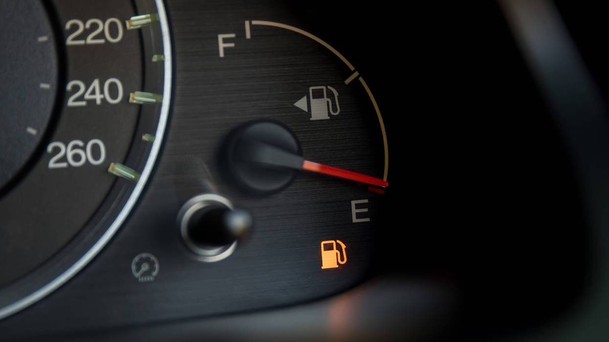 Stock photo of low fuel light in car