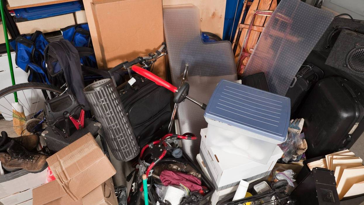 Storage pile of sporting gear, music equipment, suitcases, files, boxes and more