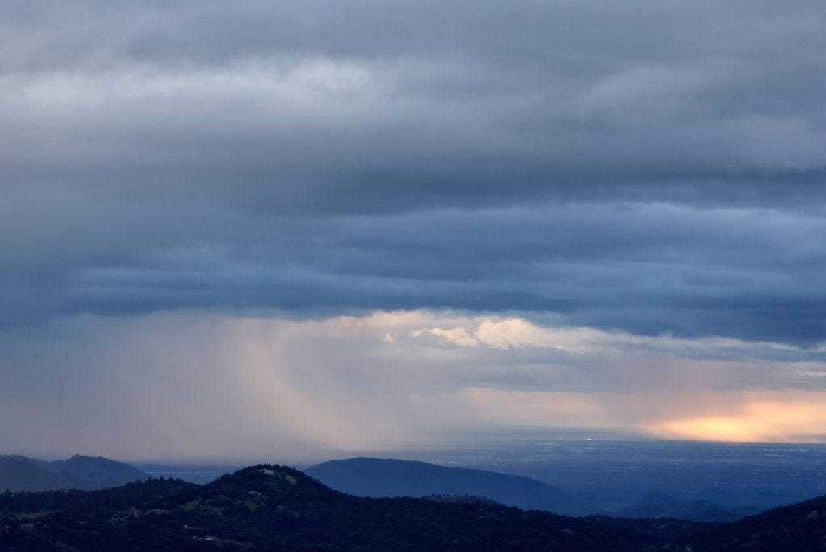 Storm clouds drop precipitation during an atmospheric river storm on February 01, 2024 near Dunlap, California. The first of two atmospheric river storms is impacting California with heavy rain and snow with 20 million people in the state under flood alerts today.
