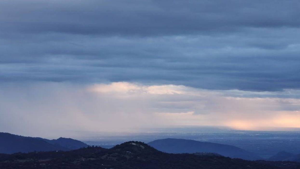 Storm clouds drop precipitation during an atmospheric river storm on February 01, 2024 near Dunlap, California. The first of two atmospheric river storms is impacting California with heavy rain and snow with 20 million people in the state under flood alerts today. (Photo by Mario Tama/Getty Images)