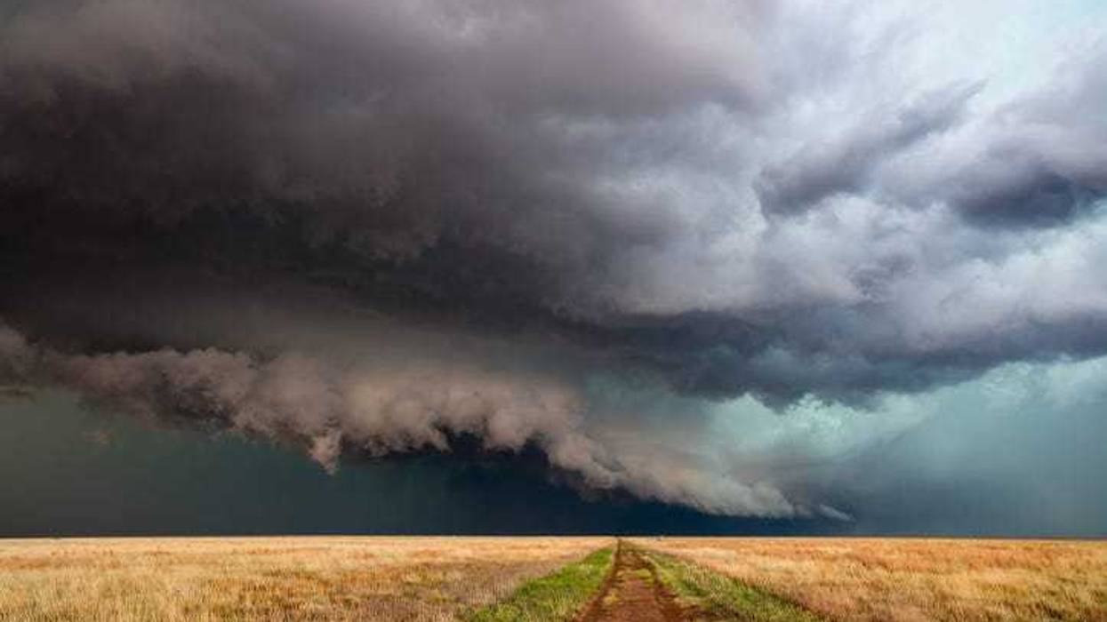 Storm over a dirt road.