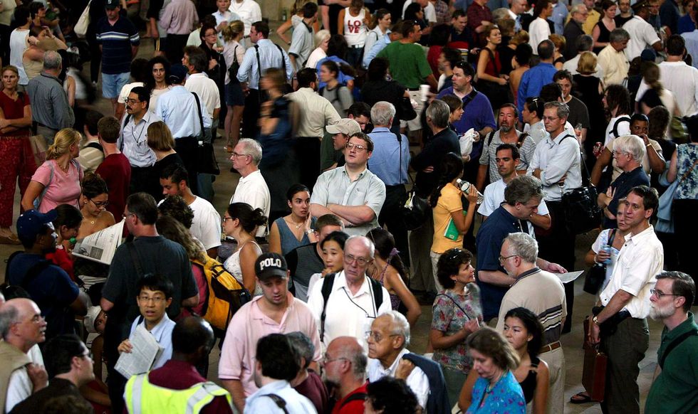 Stranded travellers gather in Grand Central Station on the second day of the blackout.