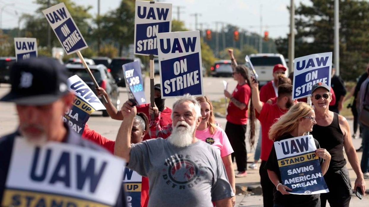 Striking Ford Motor Company workers picket outside of Gate 9 at the Michigan Assembly in Wayne where the Ford Bronco is made on Friday, Sept. 15, 2023.
