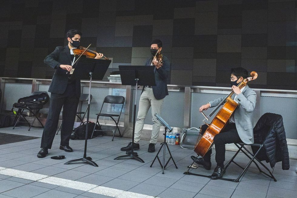 String trio at U District Station