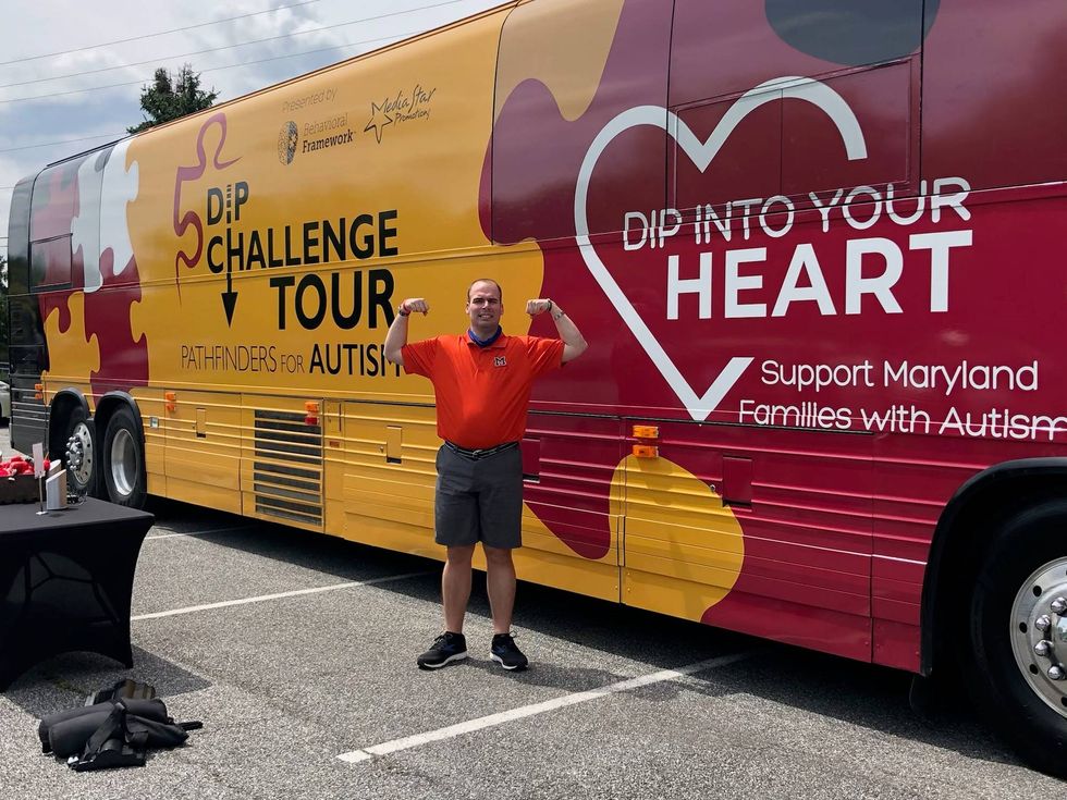 Strong Man Flex at the Dip Challenge Bus
