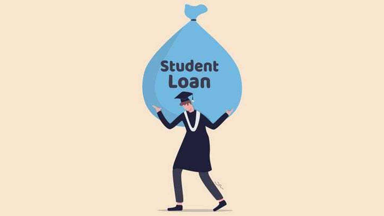 student wearing graduation ceremony suit holding heavy expensive student loan money bag.