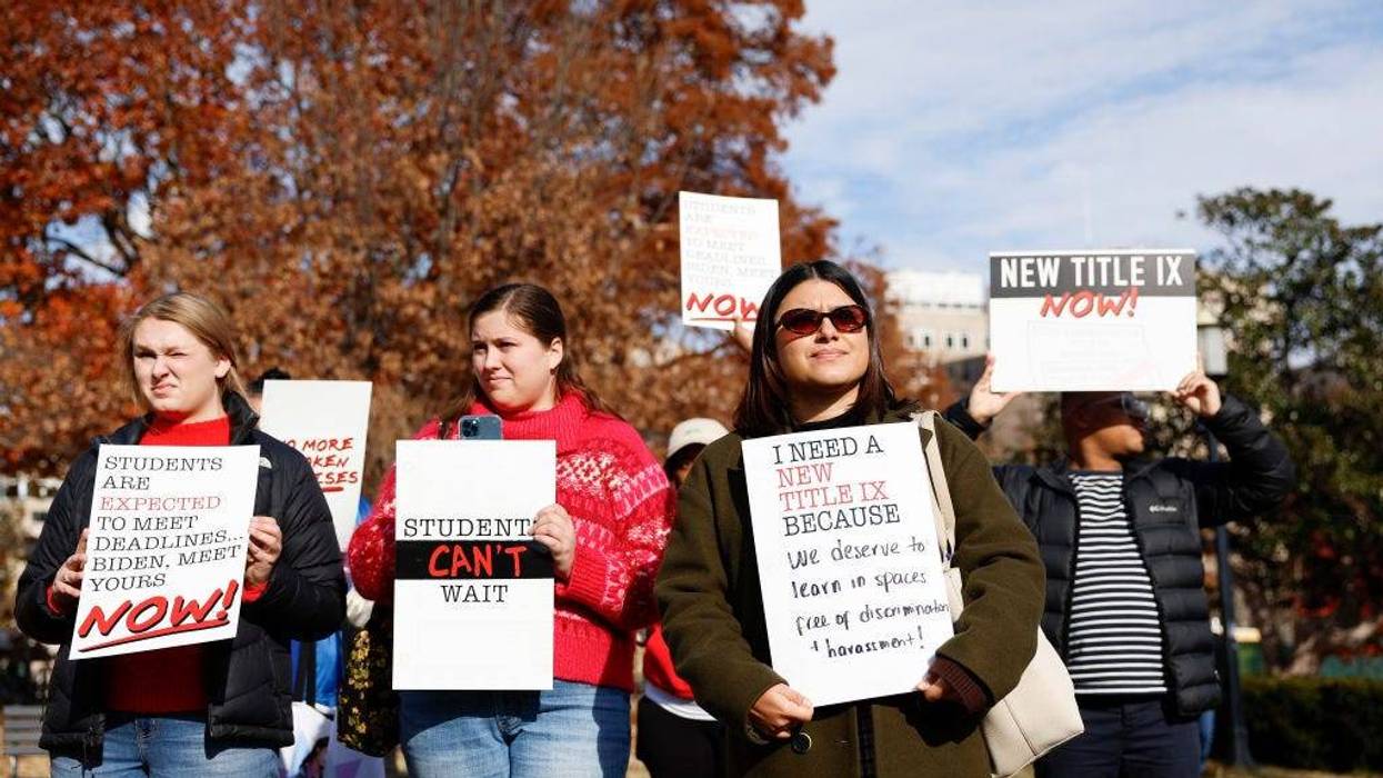 Students And Advocates Urge The Biden Administration To Issue Final Title IX Ruling WASHINGTON, DC - DECEMBER 05: Activists hold up signs as they listen during a Title IX rally at Lafayette Park near the White House on December 05, 2023 in Washington, DC. Activists and students attended the rally to call on U.S. President Joe Biden to finalize a new Title IX rule to help protect victims of sexual assault and LGBTQIA+ students on college campuses.
