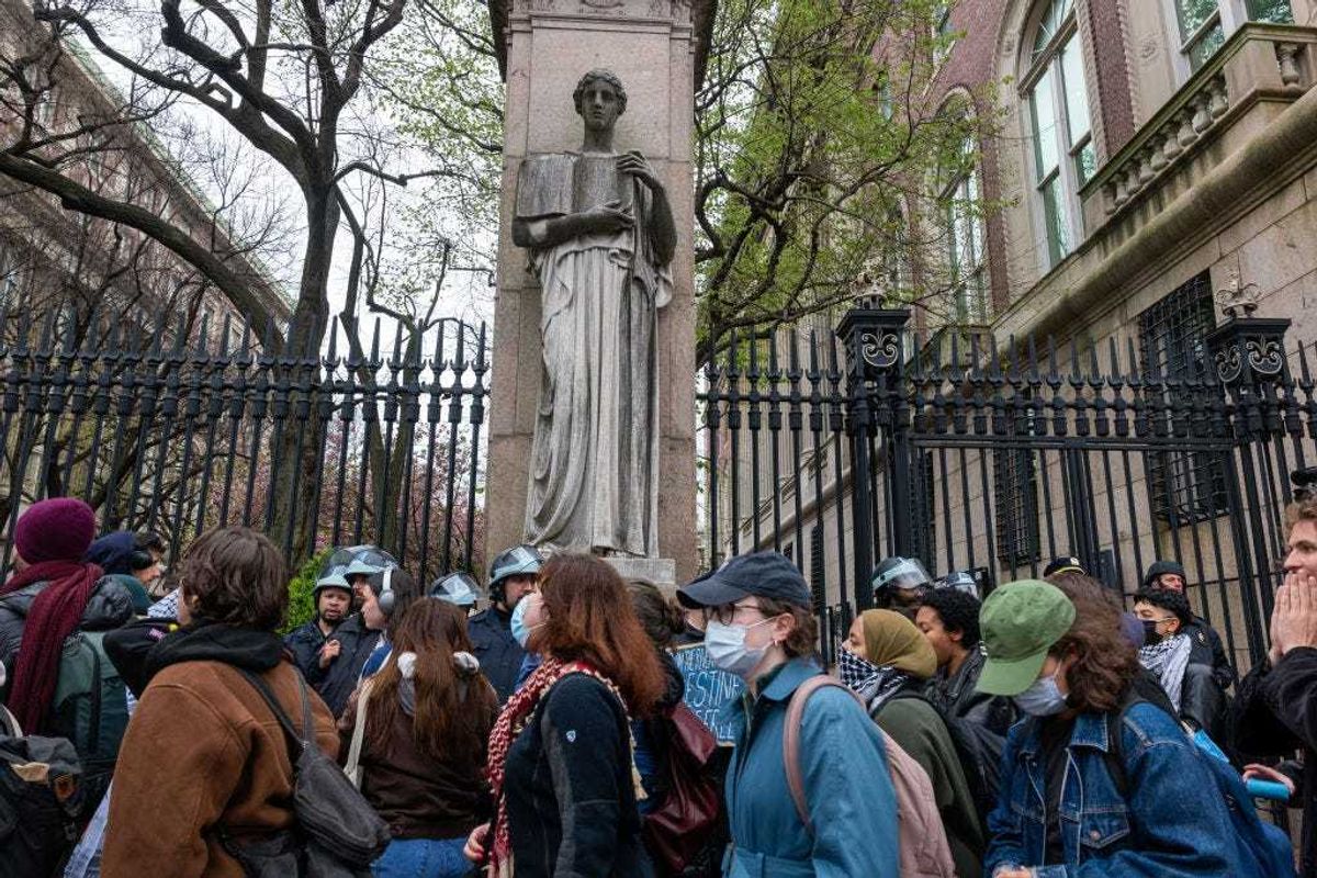 Students and pro-Palestinian activists gather outside of Columbia University to protest the university's stance on Israel on April 18, 2024 in New York City. The protests come after numerous students were arrested earlier in the day after setting up tents on the university lawn in support of Gaza. (Photo by Spencer Platt/Getty Images)