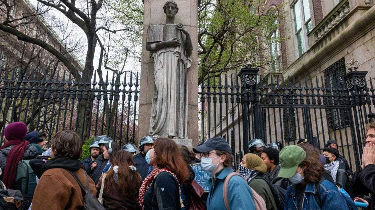Students and pro-Palestinian activists gather outside of Columbia University to protest the university's stance on Israel on April 18, 2024 in New York City. The protests come after numerous students were arrested earlier in the day after setting up tents on the university lawn in support of Gaza. (Photo by Spencer Platt/Getty Images)
