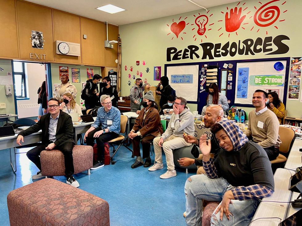 Students and teachers gathered together to listen to the music produced by the class.