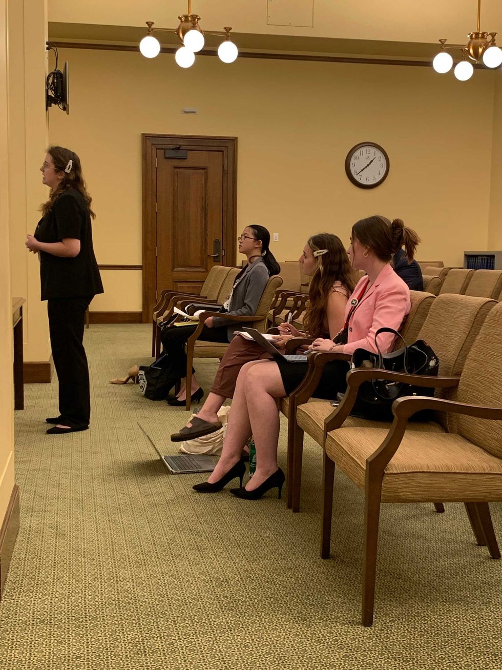 Students arguing in appellate court, modeling U.S Supreme Court