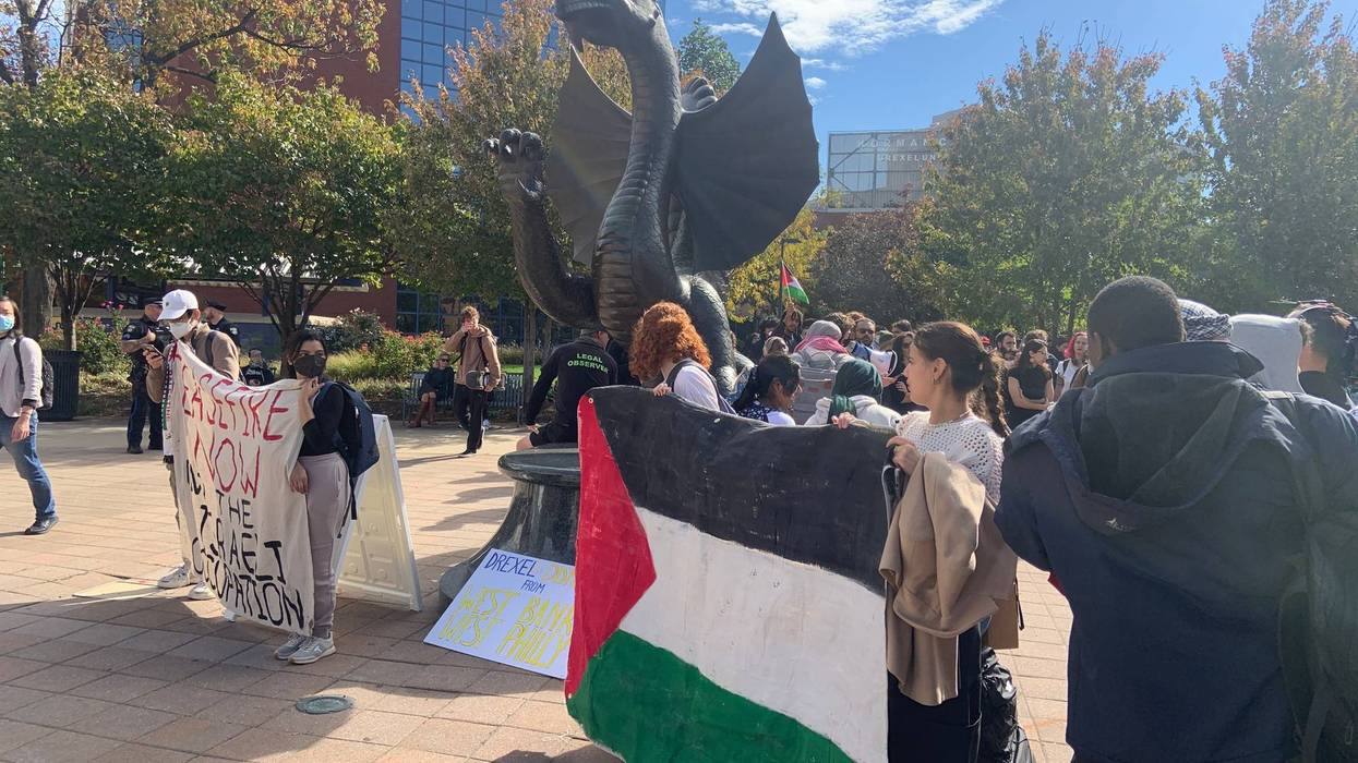 Students from Penn and Drexel on Wednesday started their demonstration at Drexel's dragon statue before walking a half-mile to Penn's campus.