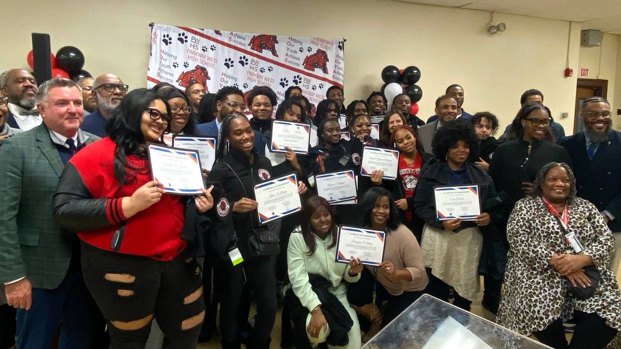 Students pose with certificates from teaching pre-apprenticeship program at Parkway West High School.