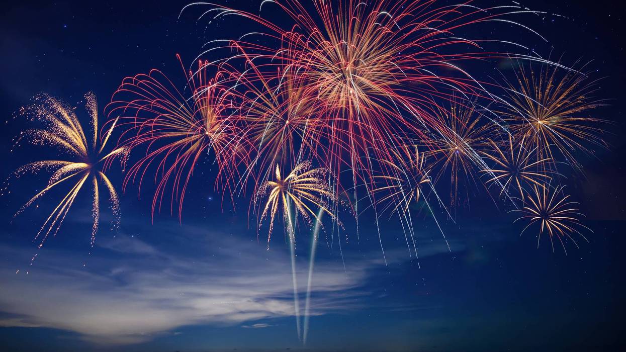 Stunning fireworks illuminate the night sky over the ocean, symbolizing celebration, hope, and the excitement of welcoming 2026 with bright new beginnings.