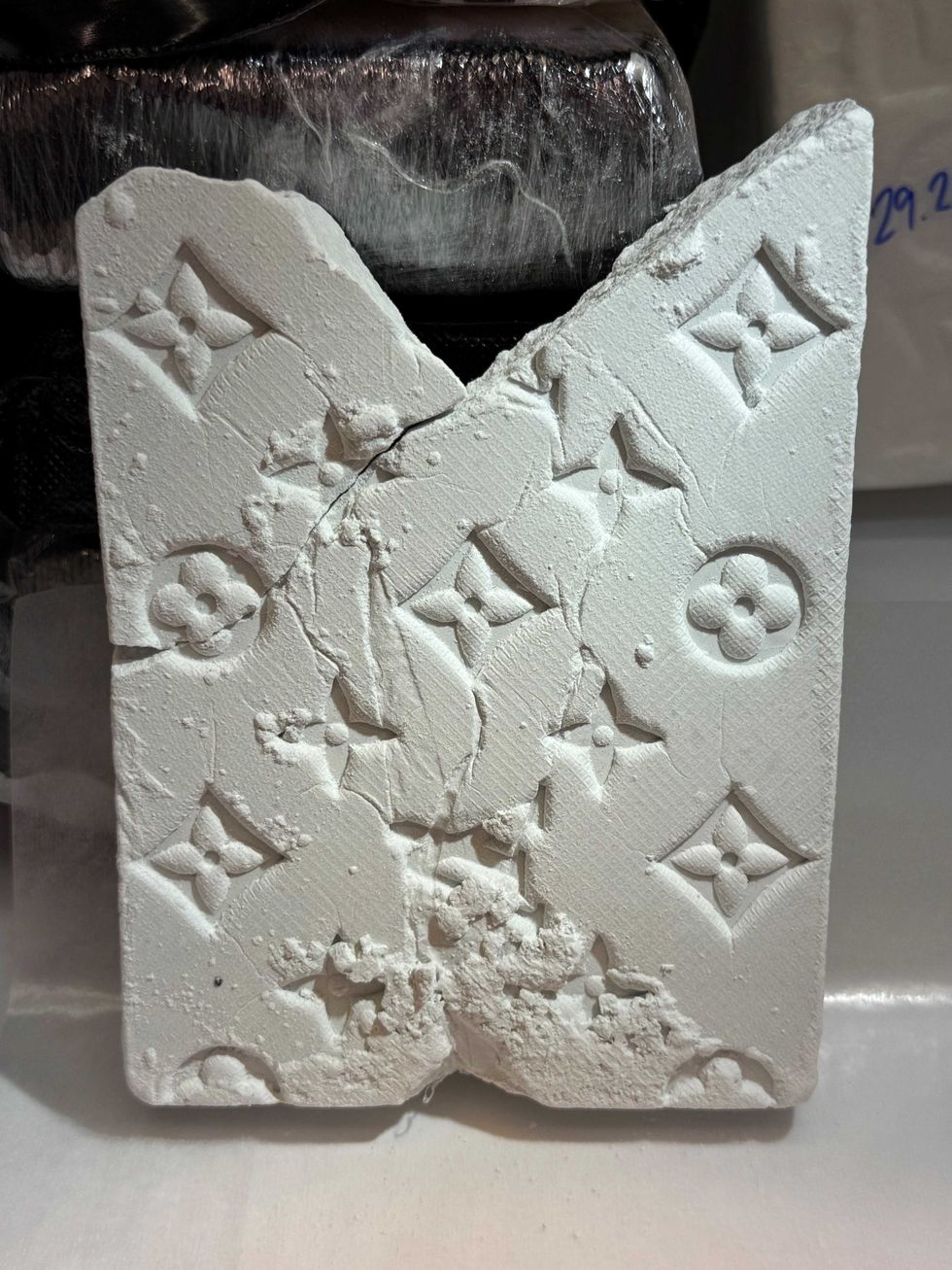 Subsequent DEA laboratory analysis determined the kilogram packages found inside the Honda included 33 kilograms of cocaine, some labelled "MOËT" and "AMIRI," and over six kilograms of fentanyl, some marked with Louis Vuitton symbols.