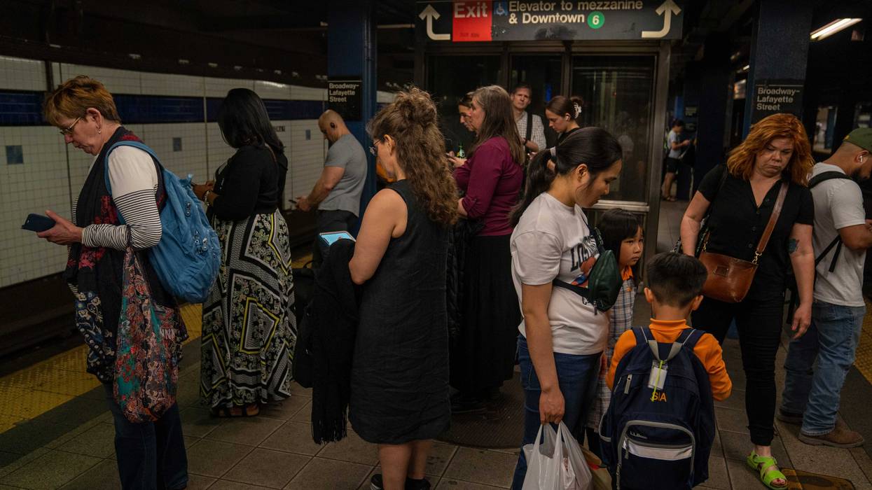 Subway passengers wait for a downtown train at the Broadway–Lafayette Street/Bleecker Street station on April 29, 2024
